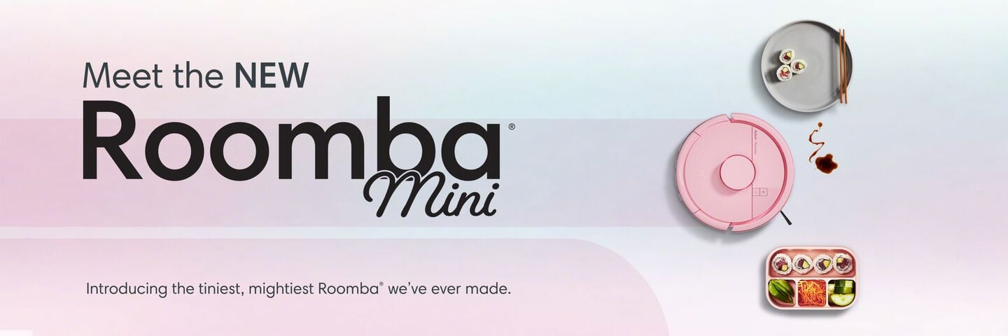 meet the new roomba mini, introducing the tiniest, mightiest Roomba we've ever made. Pink Roomba Mini positioned next to a plate and bento box